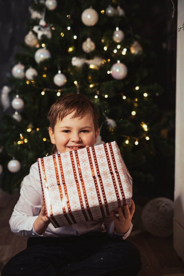 young boy with Christmas present